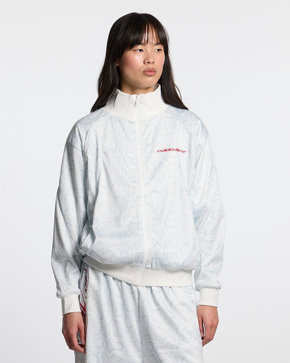 RIOT MESH JACKET WHITE - white snakeskin print track jacket, front view on female model - Cold Culture #woman