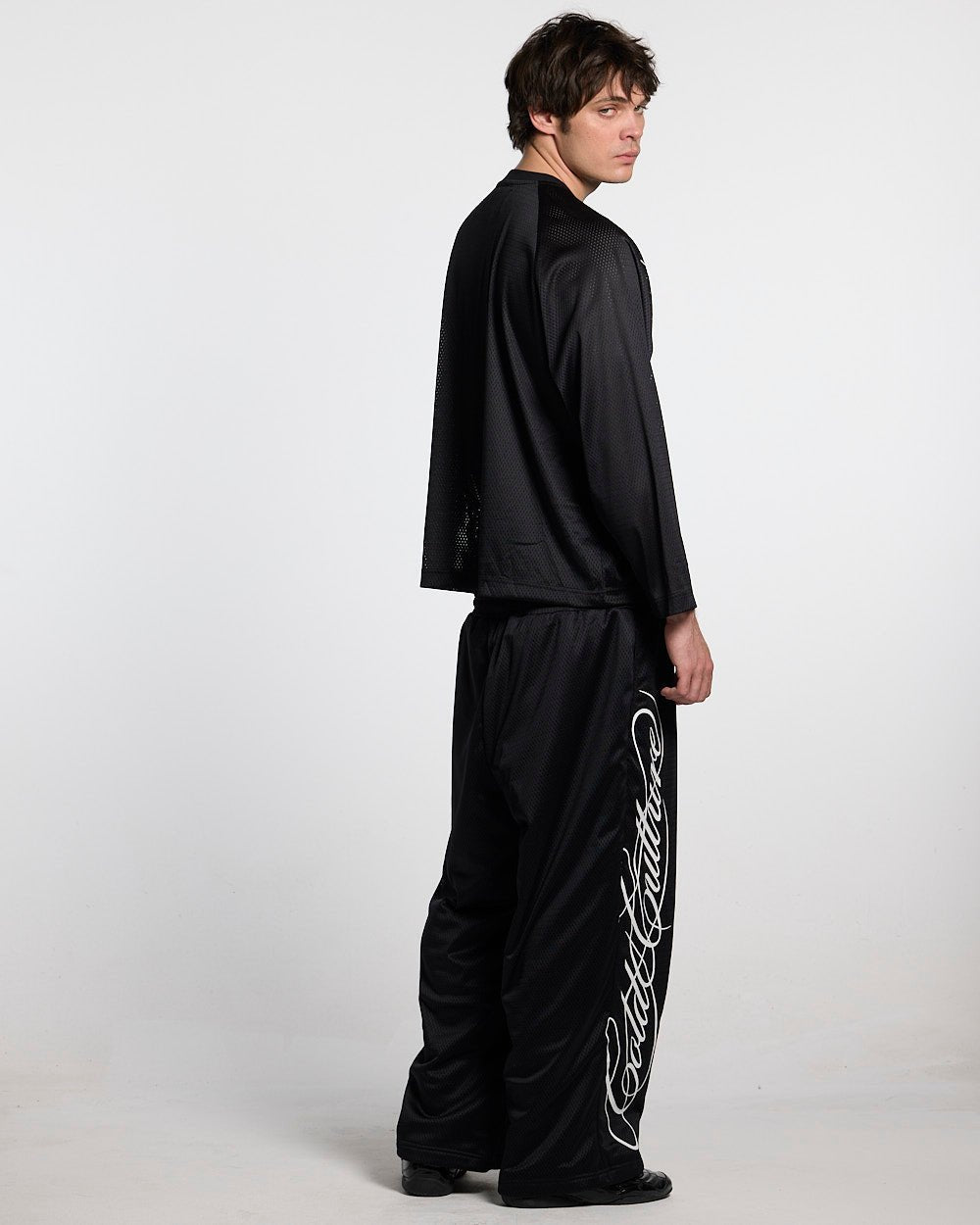 RIOT MESH LONGSLEEVE BLACK - black mesh longsleeve tee, back view on male model - Cold Culture #man