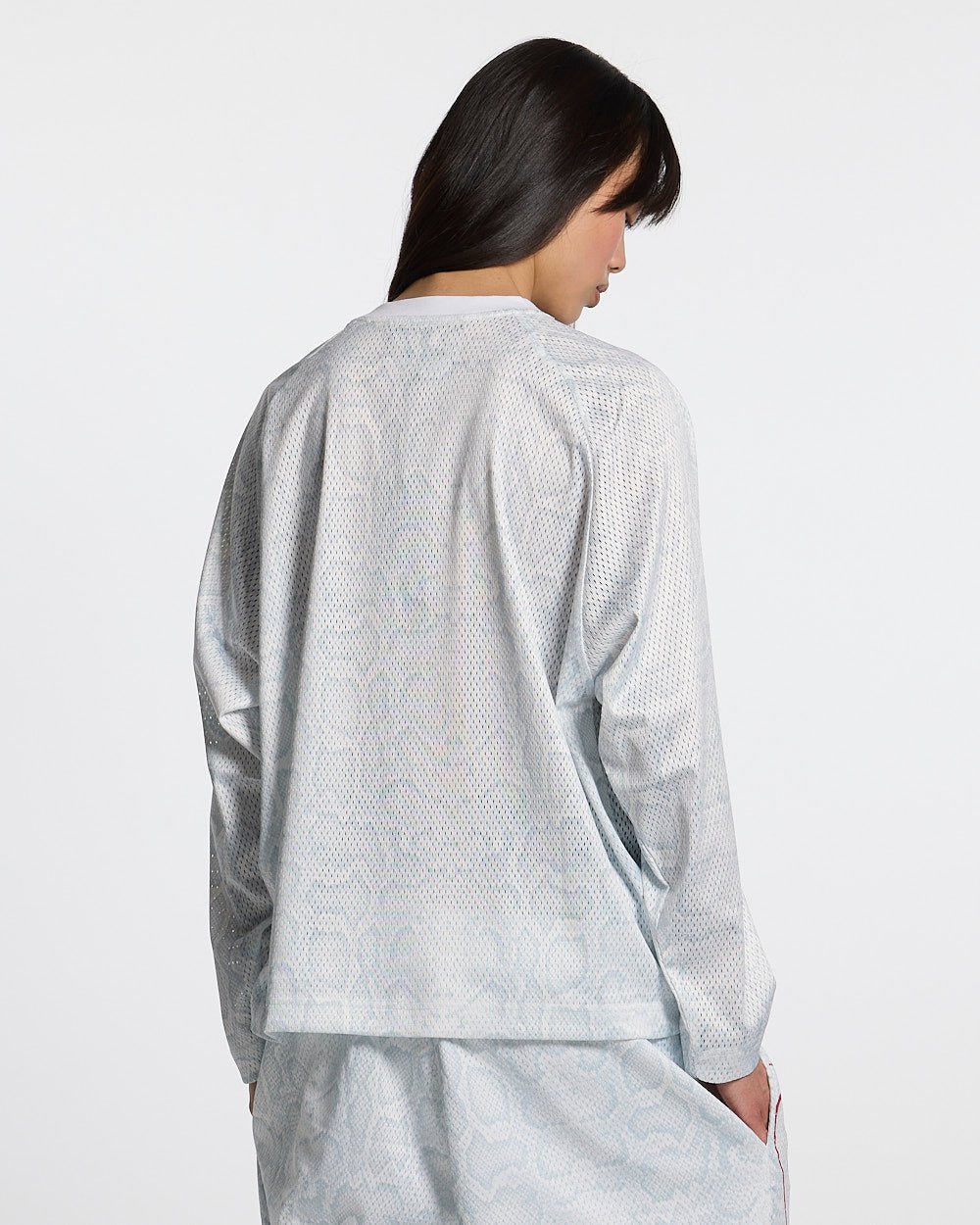 RIOT MESH LONGSLEEVE WHITE - white mesh longsleeve tee, back view on female model - Cold Culture #woman