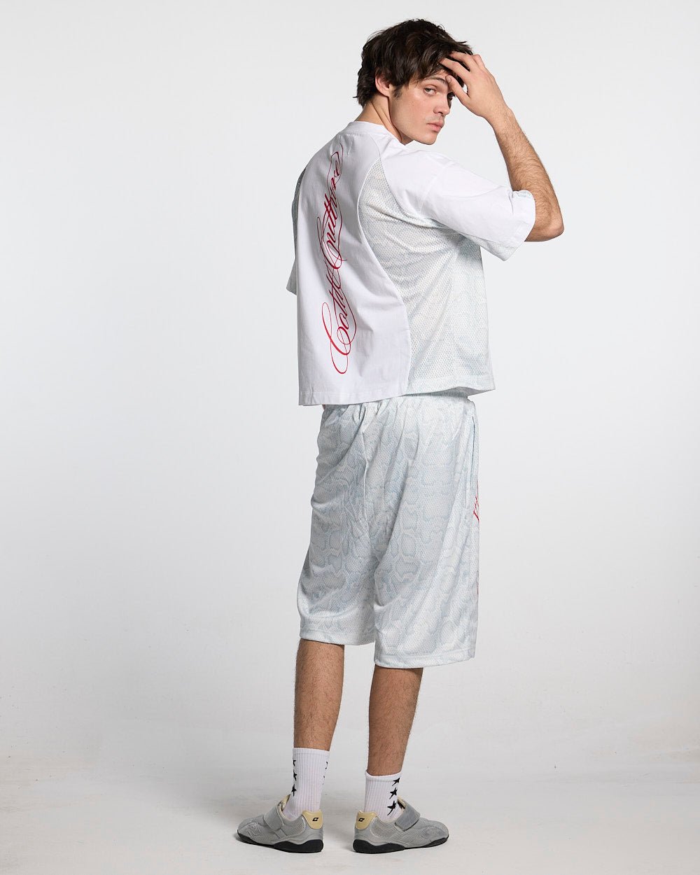 RIOT MESH SHORT WHITE - white snake print mesh shorts, back view on male model - Cold Culture #man
