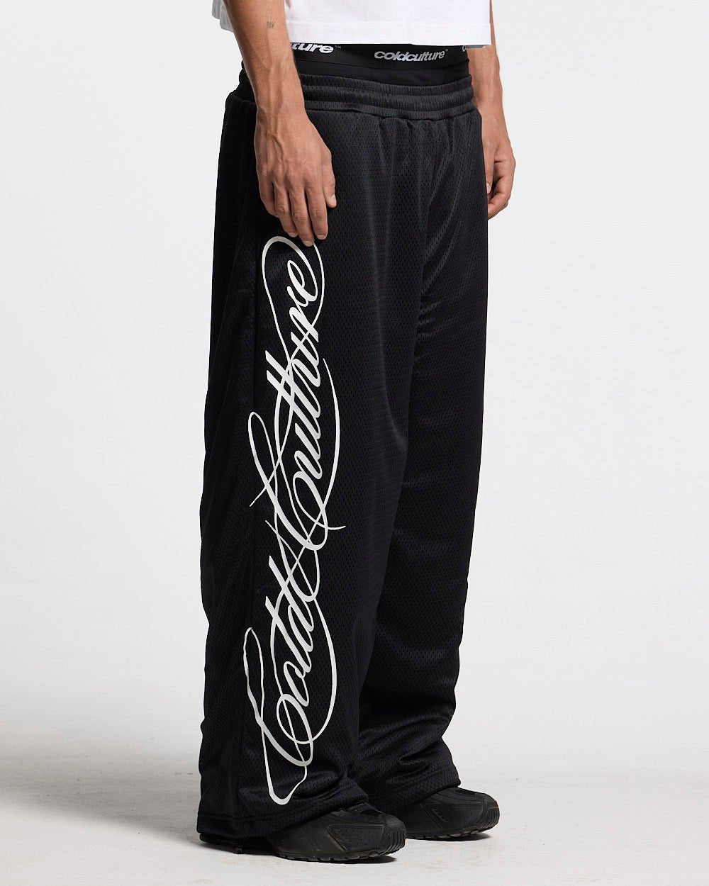 RIOT MESH SWEATPANTS BLACK - black mesh sweatpants, side view - Cold Culture