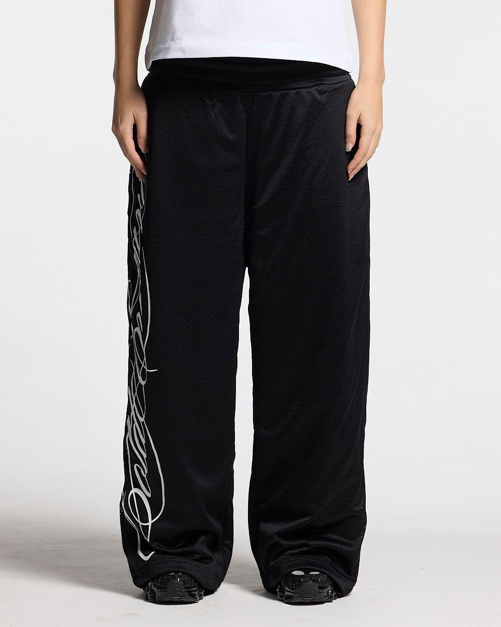 RIOT MESH SWEATPANTS BLACK - black mesh sweatpants, front view on female model - Cold Culture #woman