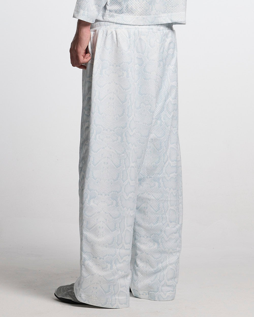 RIOT MESH SWEATPANTS WHITE - white snakeskin print sweatpants, back view on male model - Cold Culture
