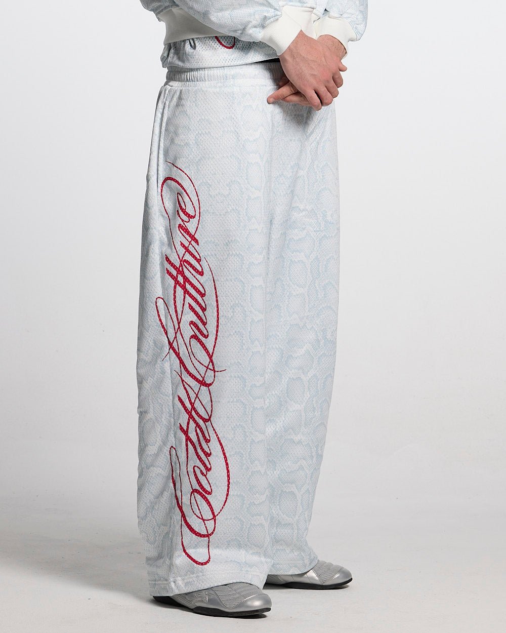 RIOT MESH SWEATPANTS WHITE - white snakeskin print sweatpants, front view on male model - Cold Culture