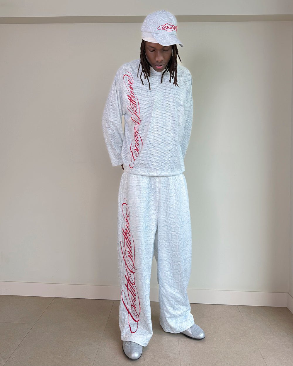 RIOT MESH SWEATPANTS WHITE - white snakeskin print sweatpants, street style shot - Cold Culture