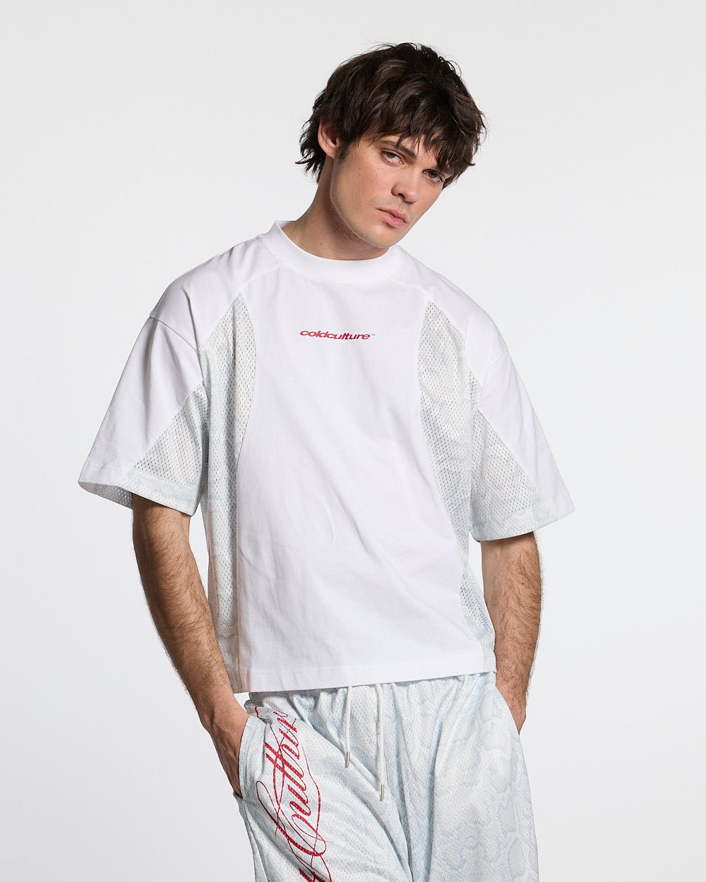 RIOT MESH TEE WHITE - white mesh panel tee, front view on male model - Cold Culture #man