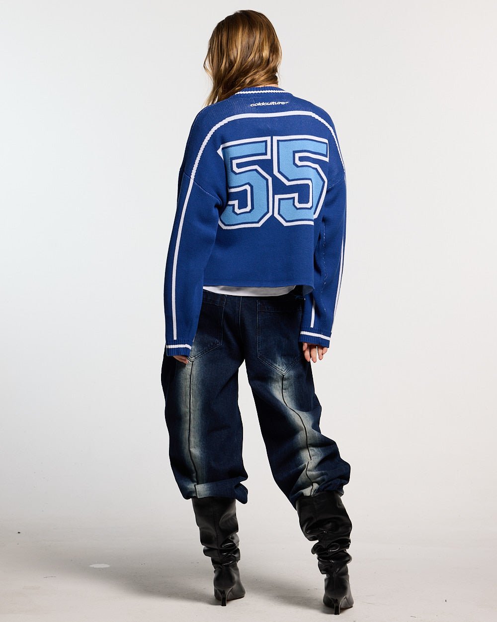 ROLLER KNIT BLUE - blue varsity knit sweater, back view on female model - Cold Culture #woman