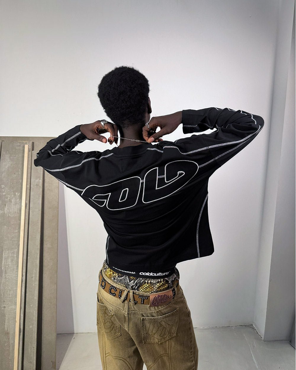 ROLLER LONGSLEEVE TEE BLACK - black oversized longsleeve tee, back view on male model - Cold Culture