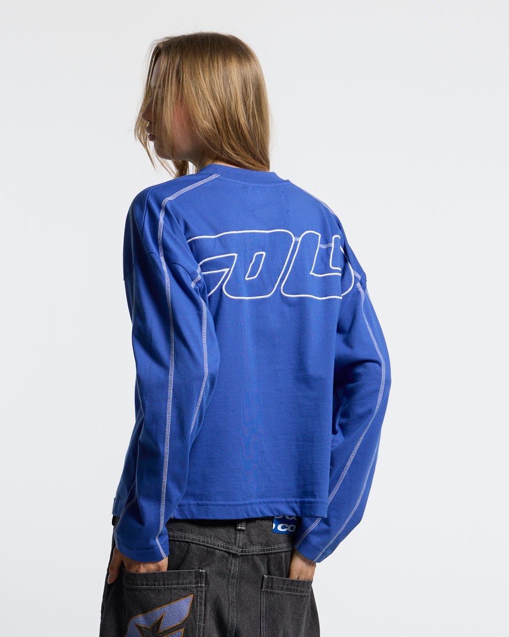 ROLLER LONGSLEEVE TEE VIBRANT BLUE - blue contrast stitch longsleeve tee, back view on female model - Cold Culture #woman