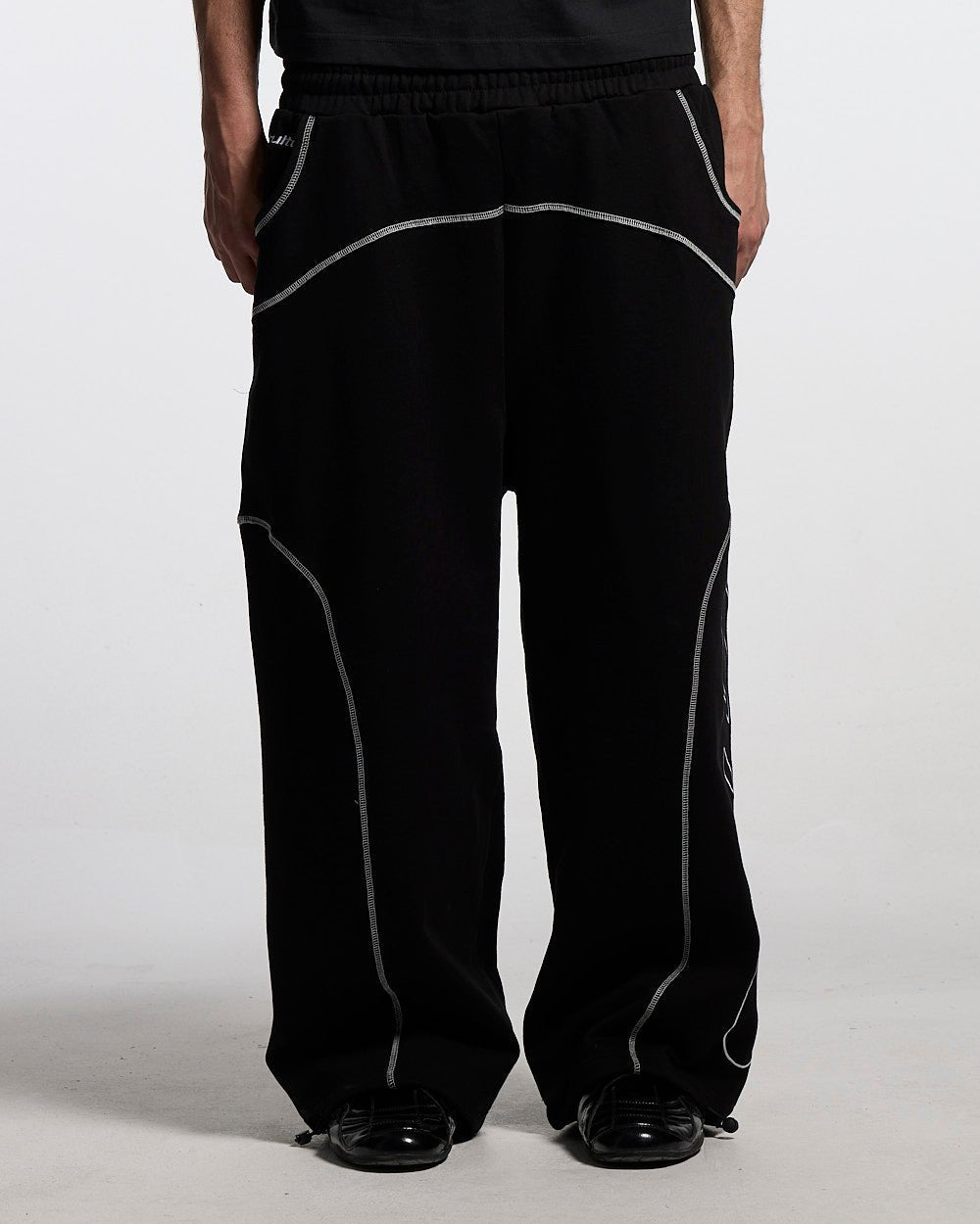 ROLLER SWEATPANTS BLACK - black contrast stitch sweatpants, front view on male model - Cold Culture