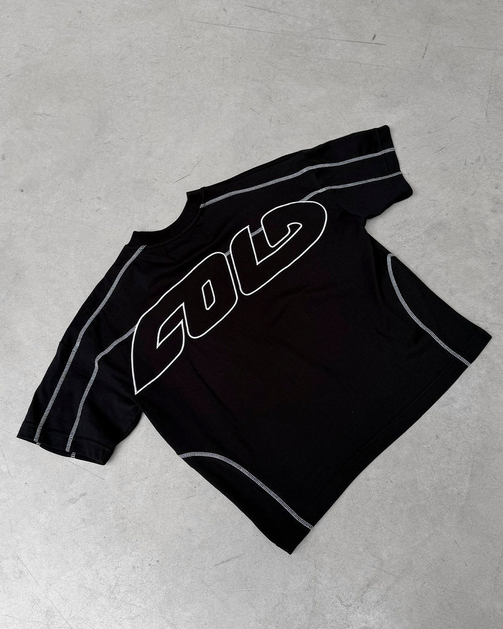 ROLLER TEE BLACK - black contrast stitch boxy tee, flat lay - Cold Culture
