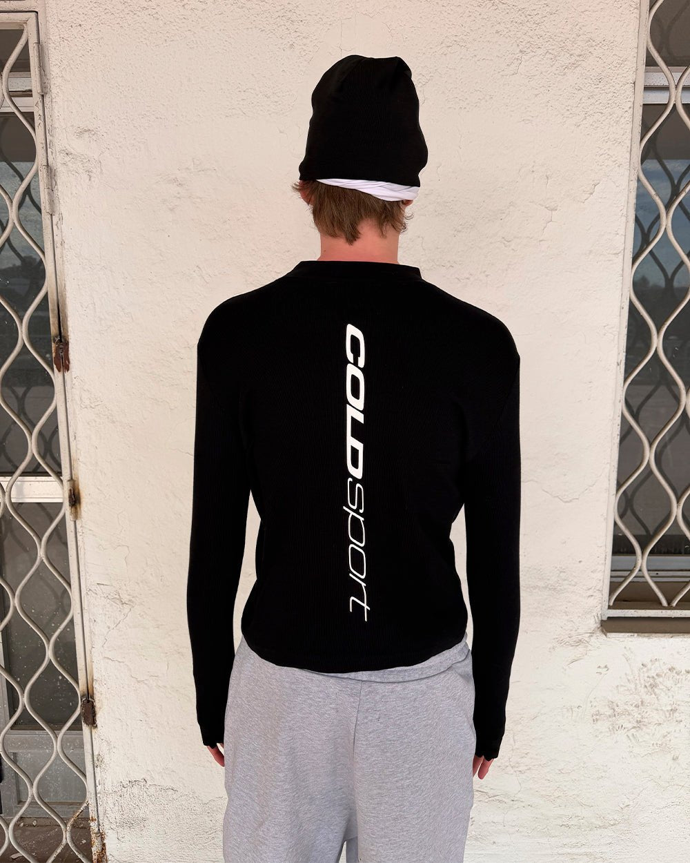 RUN CLUB LONGSLEEVE BLACK - black longsleeve tee, street style shot - Cold Culture