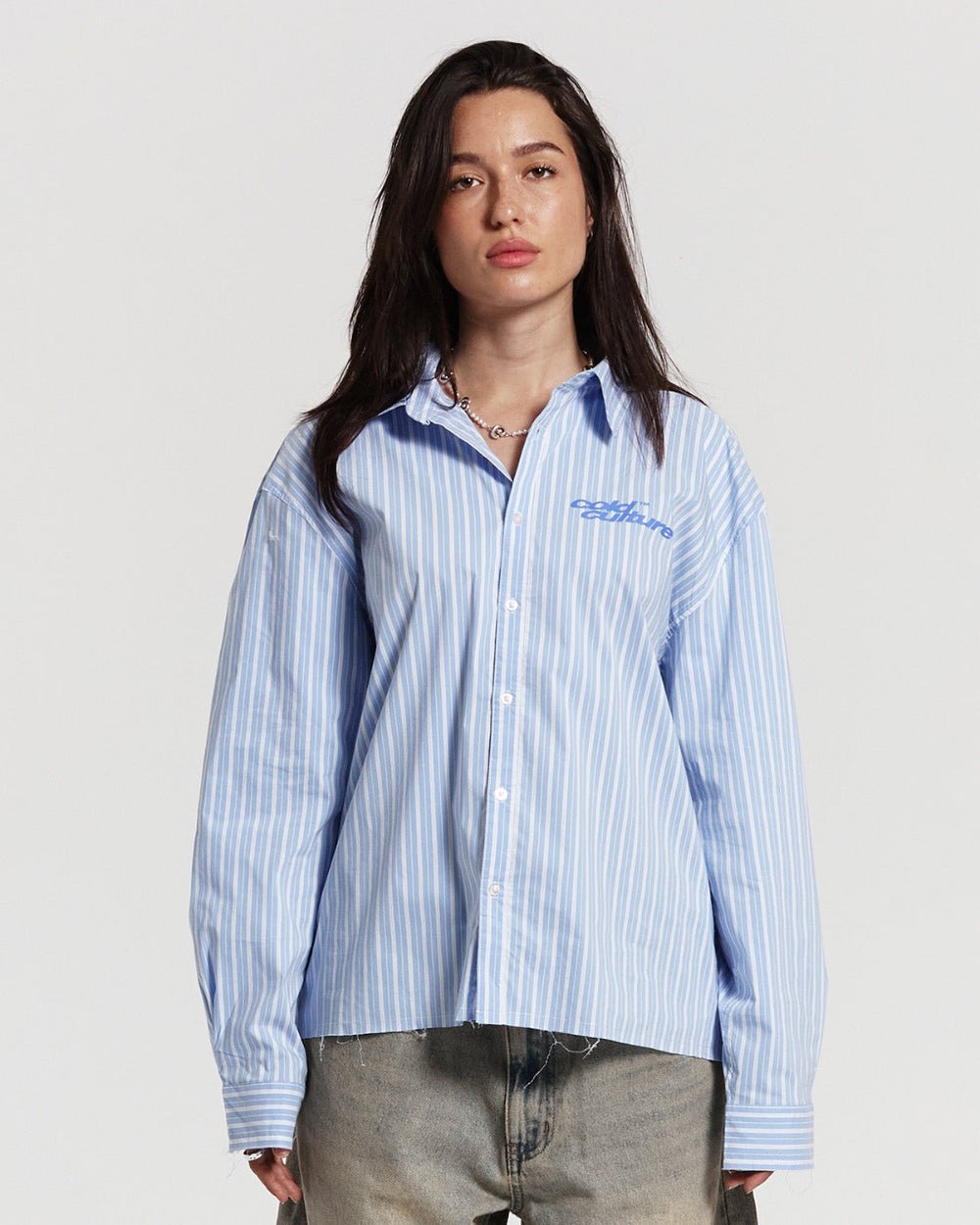 RUNNING HORSE SHIRT BLUE STRIPES - blue striped long sleeve shirt, front view on female model - Cold Culture #woman
