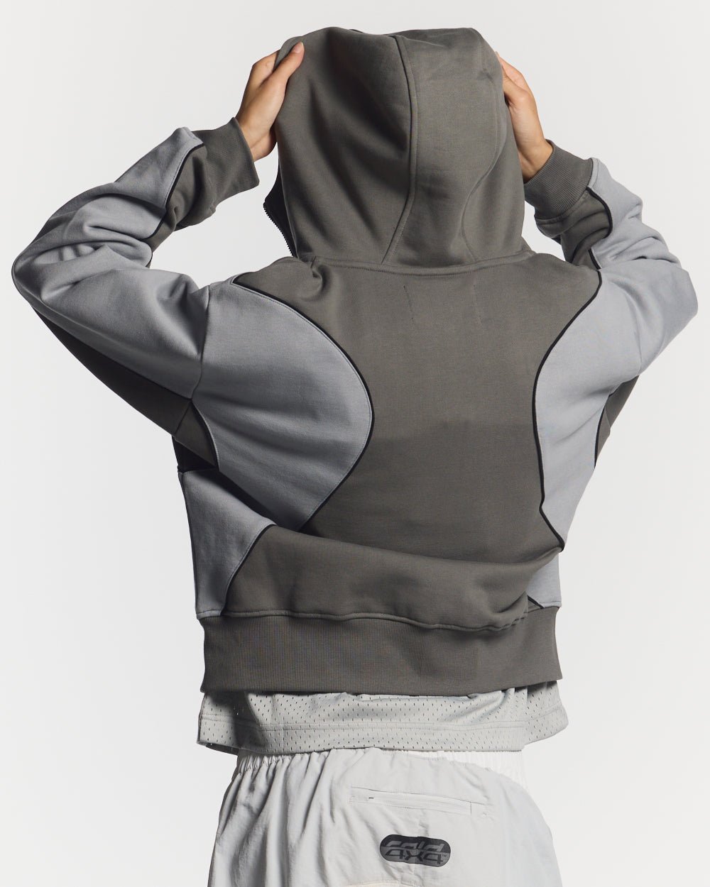 RUSH ZIPPER HOODIE GREY - grey two-tone zip-up hoodie, back view on female model - Cold Culture #woman