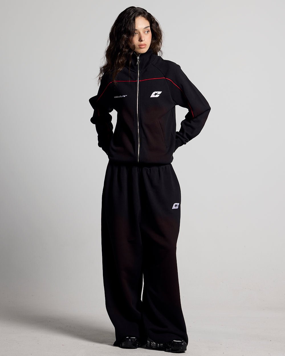 SAVAGE WASHED PANTS BLACK & RED - black and red washed sweatpants, front view on female model - Cold Culture #woman