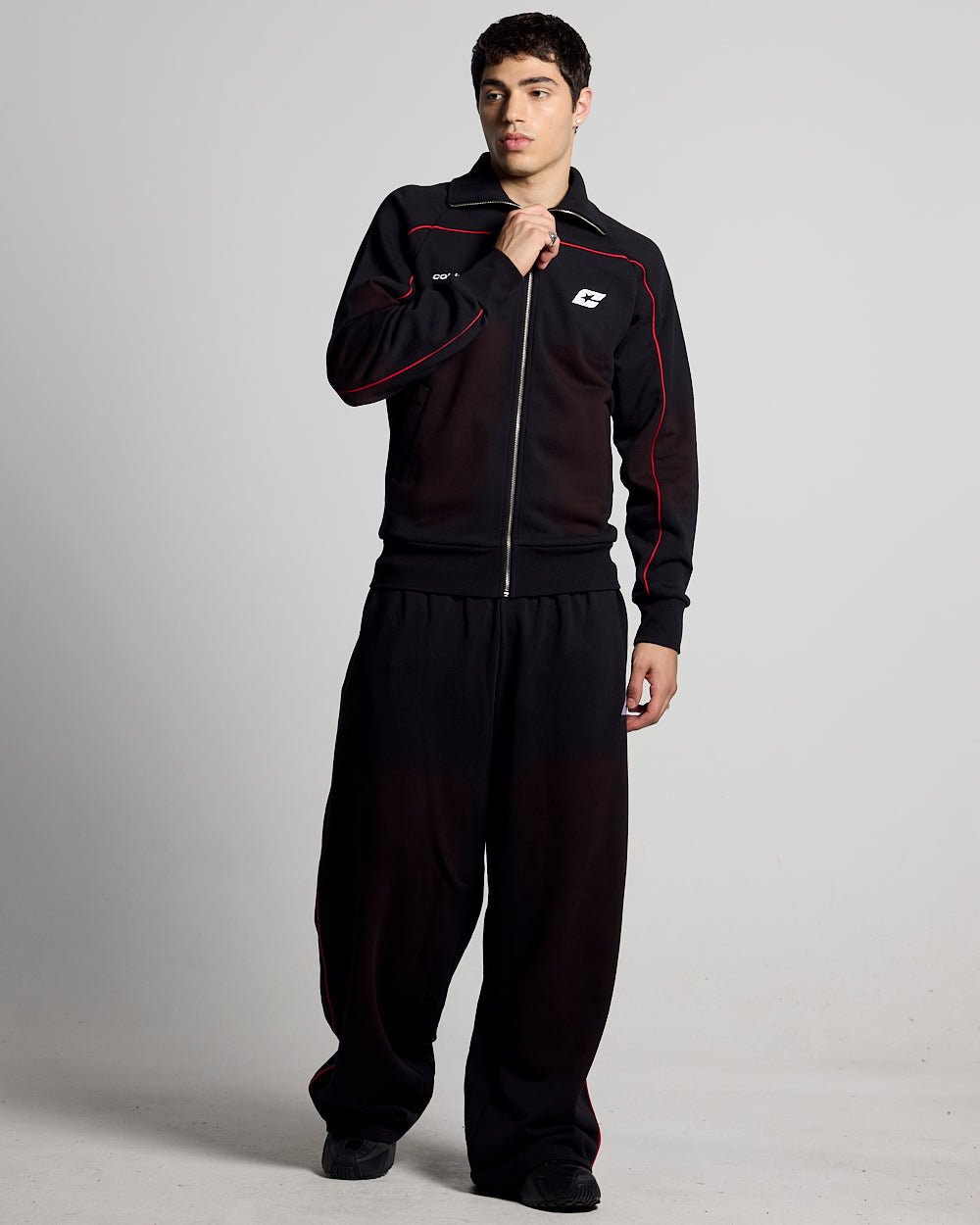 SAVAGE WASHED PANTS BLACK & RED - black and red washed sweatpants, front view on male model - Cold Culture #man