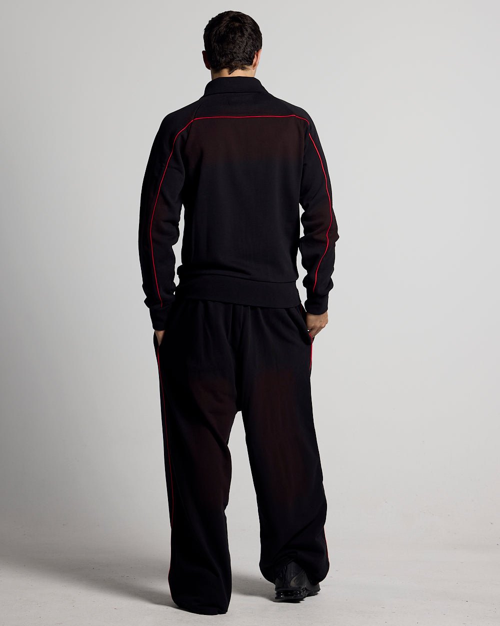 SAVAGE WASHED PANTS BLACK & RED - black and red washed sweatpants, back view on male model - Cold Culture #man