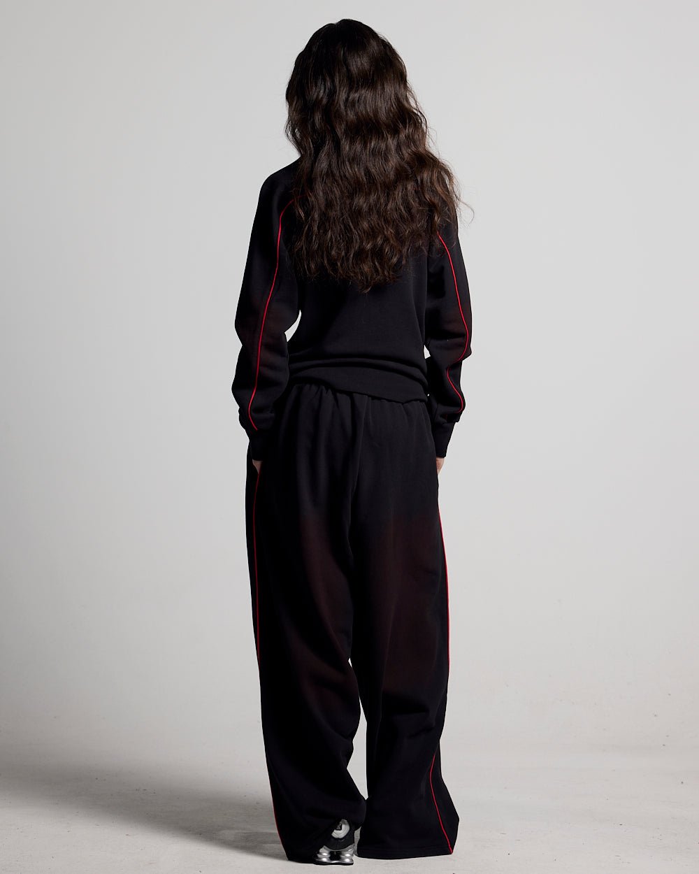 SAVAGE WASHED PANTS BLACK & RED - black and red washed sweatpants, back view on female model - Cold Culture #woman