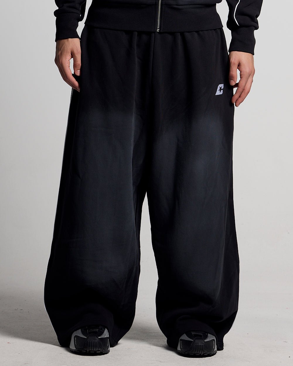 SAVAGE WASHED PANTS BLACK & WHITE - black and white washed sweatpants, front view on male model - Cold Culture