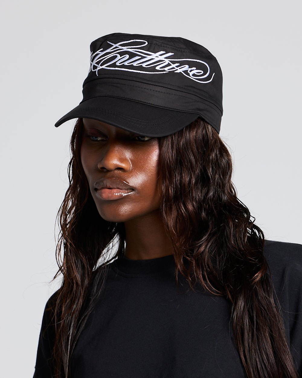 SCRIPT CAP BLACK - black embroidered cap, on model close-up - Cold Culture #woman
