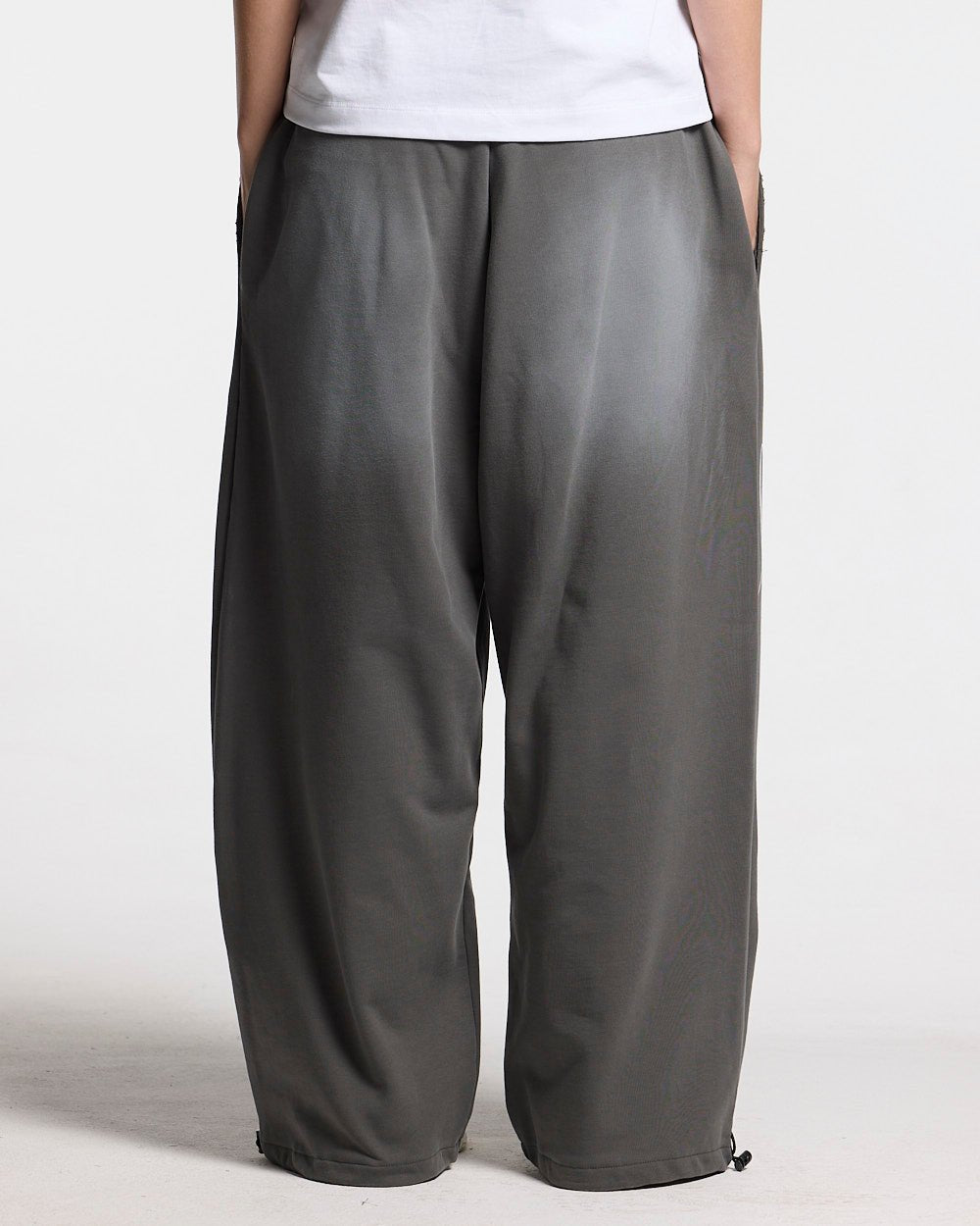 SCRIPT SWEATPANTS ANTRACITE GREY - dark grey script print sweatpants, back view on female model - Cold Culture