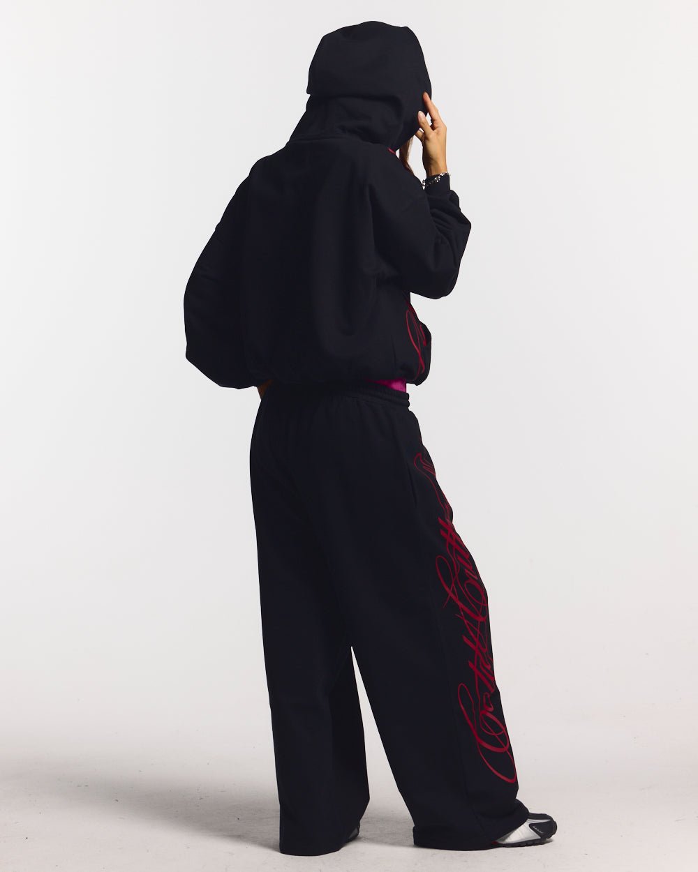 SCRIPT SWEATPANTS BLACK - black graphic print sweatpants, back view on female model - Cold Culture #woman