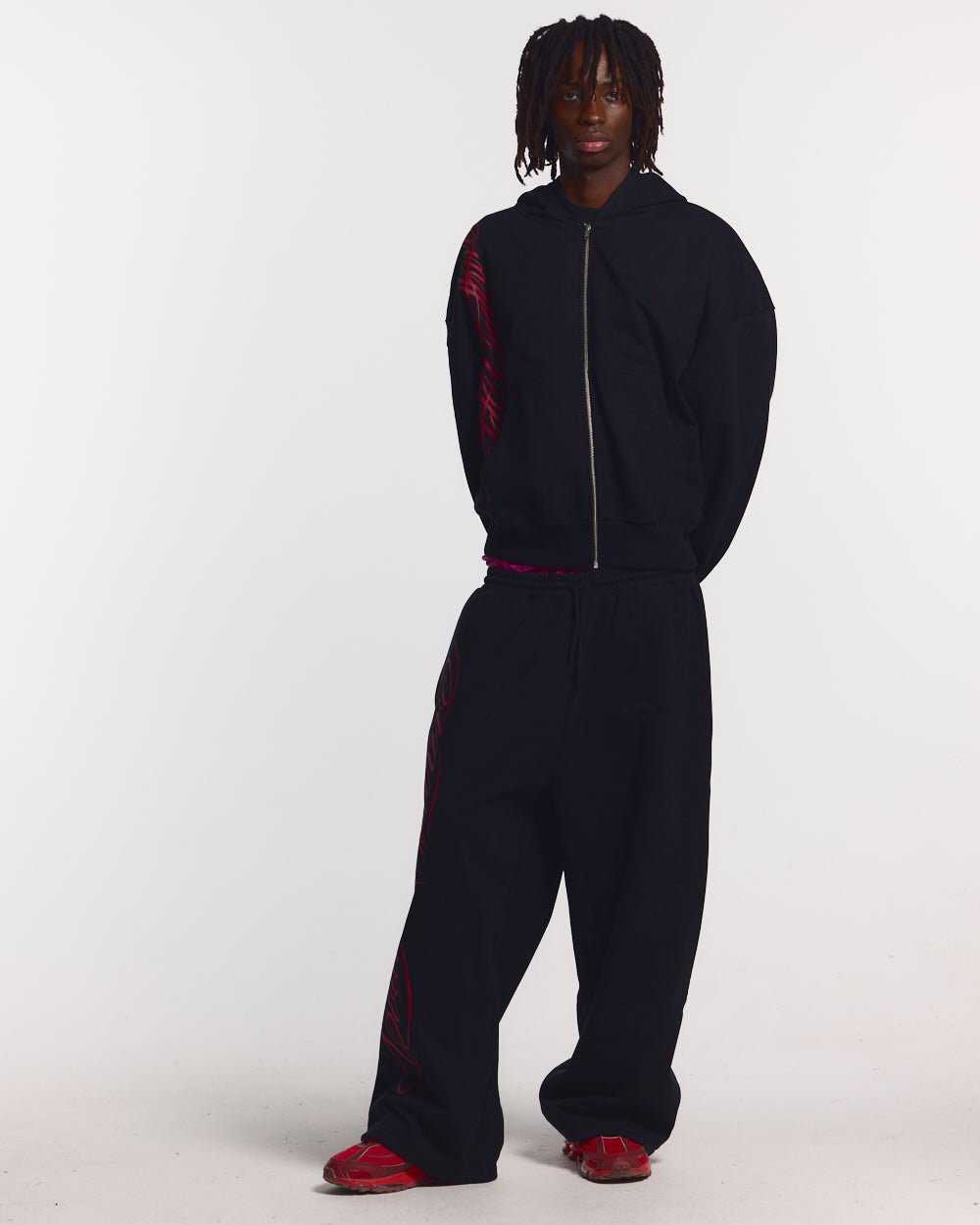 SCRIPT SWEATPANTS BLACK - black graphic print sweatpants, front view on male model - Cold Culture #man