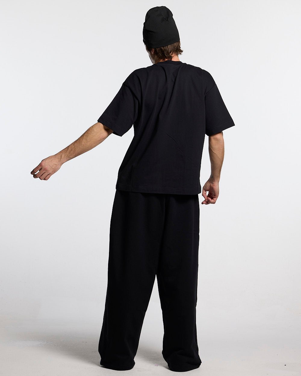 SCRIPT TEE BLACK - black script print tee, back view on male model - Cold Culture #man