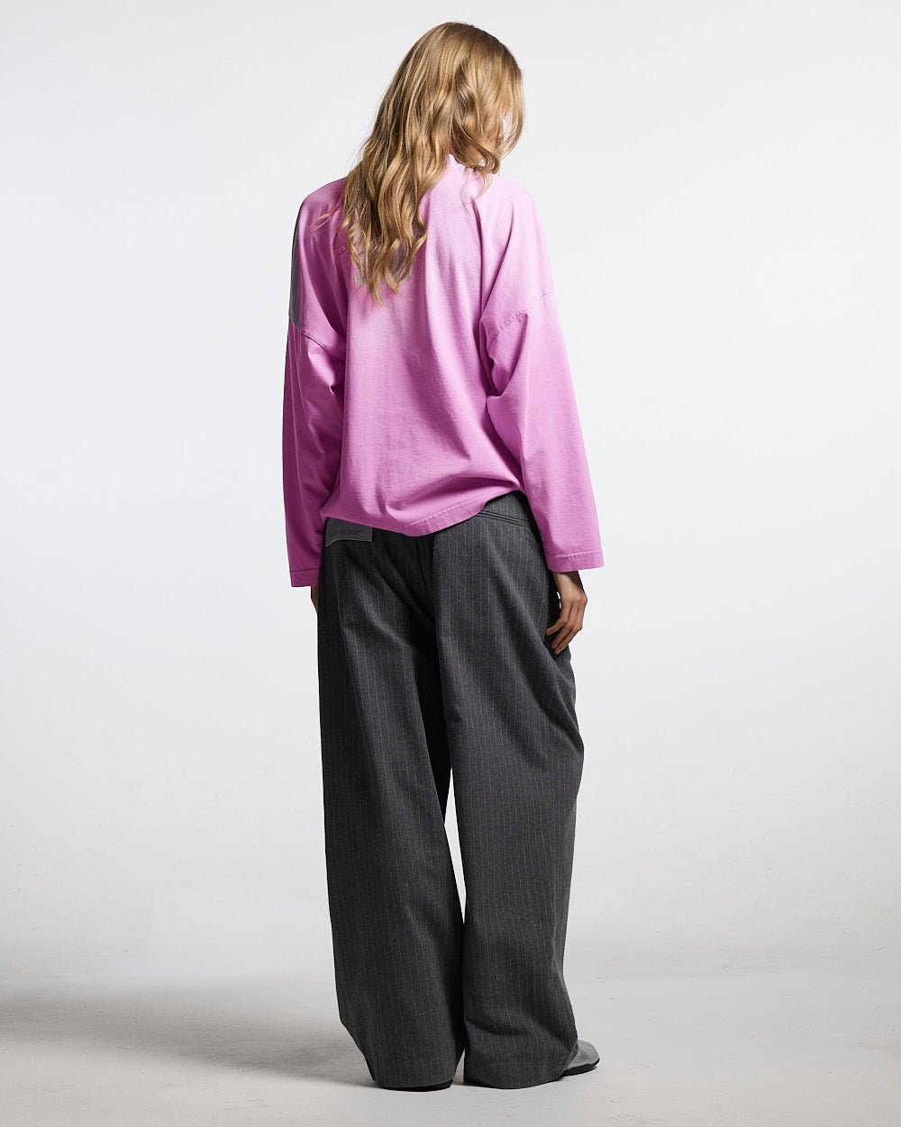 SEAM EFFECT LINE PANTS GREY - grey pinstripe pants, back view on female model - Cold Culture #woman