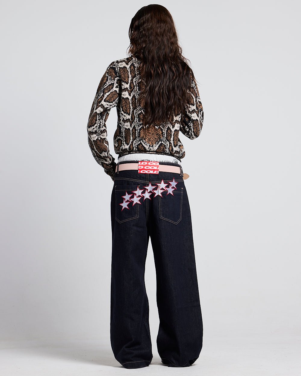 SNAKE ZIP KNIT BROWN - brown snakeskin knit sweater, back view on female model - Cold Culture #woman