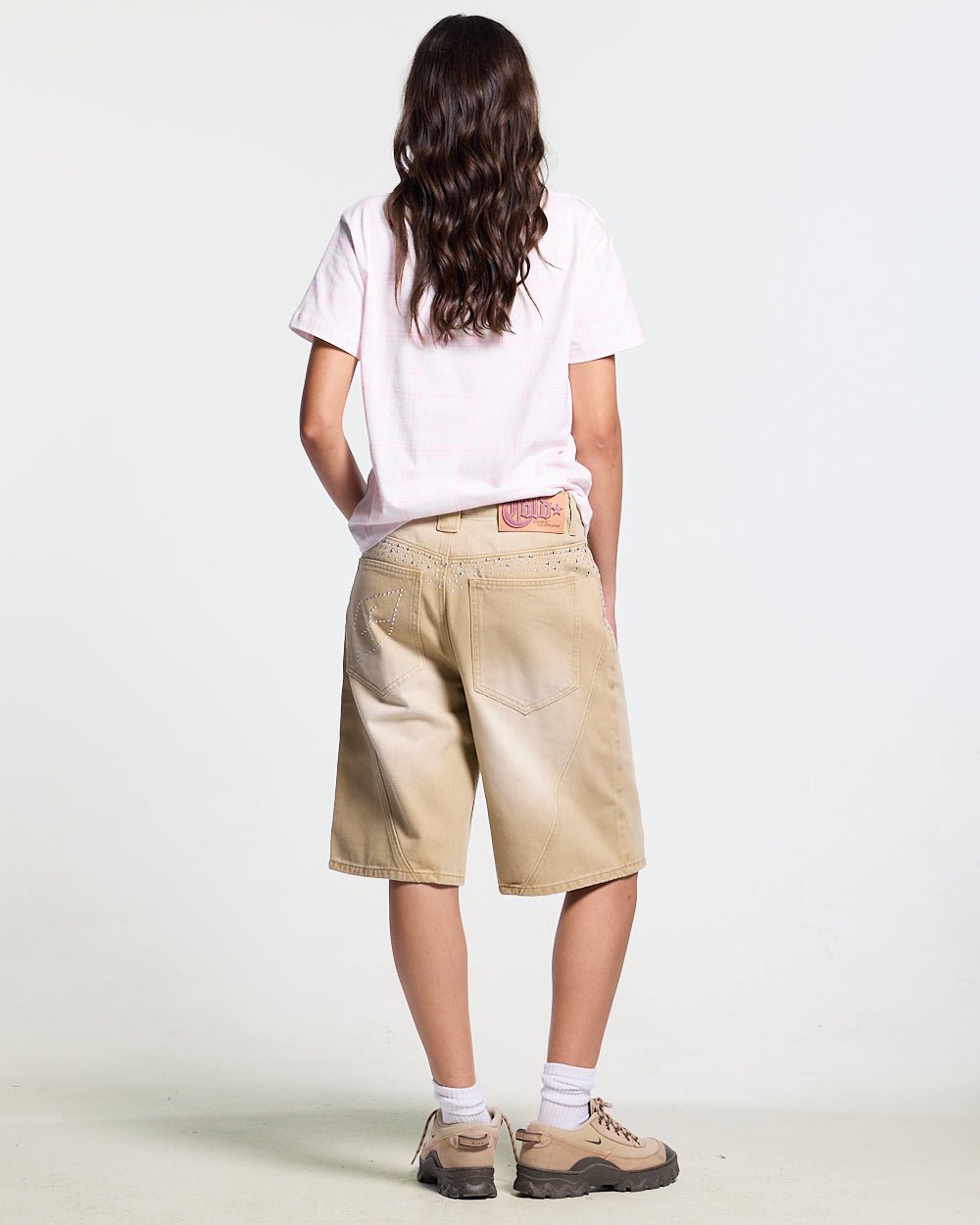 SPARK SHORTS BEIGE - beige washed denim shorts, back view on female model - Cold Culture #woman