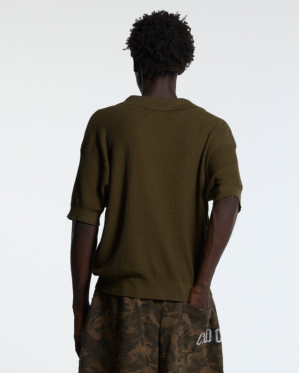 SPARROW KNIT POLO GREEN - olive green knit polo shirt, back view on male model - Cold Culture #man