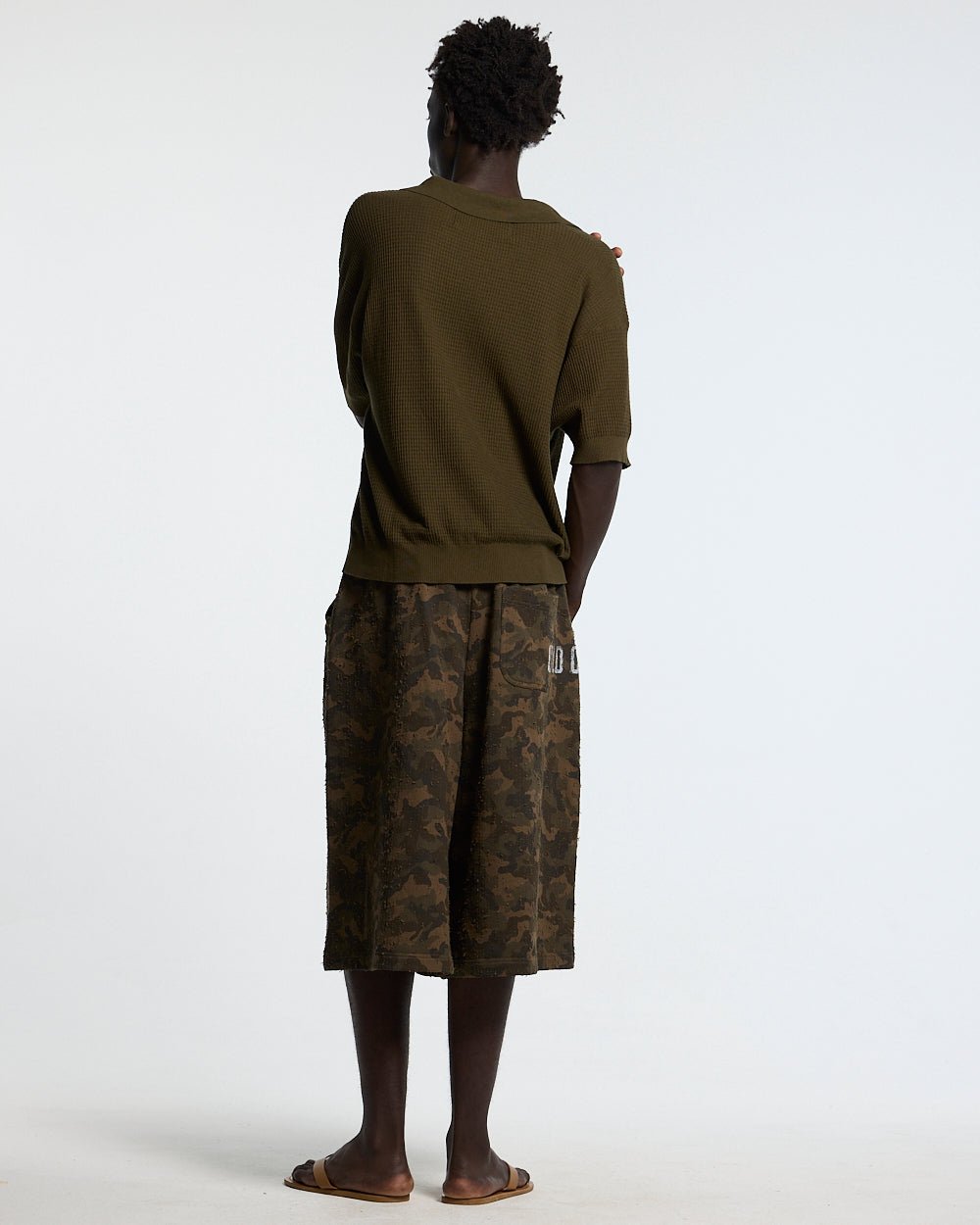 SPARROW KNIT POLO GREEN - olive green knit polo shirt, back view on male model - Cold Culture #man