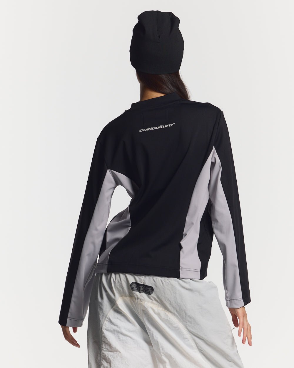 SPEED LONGSLEEVE BLACK - black two-tone longsleeve tee, back view on female model - Cold Culture #woman