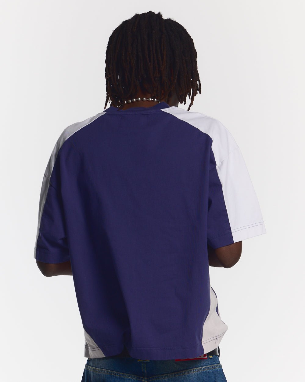 SPEED SPOKE TEE BLUE - navy and white panelled tee, back view on male model - Cold Culture #man