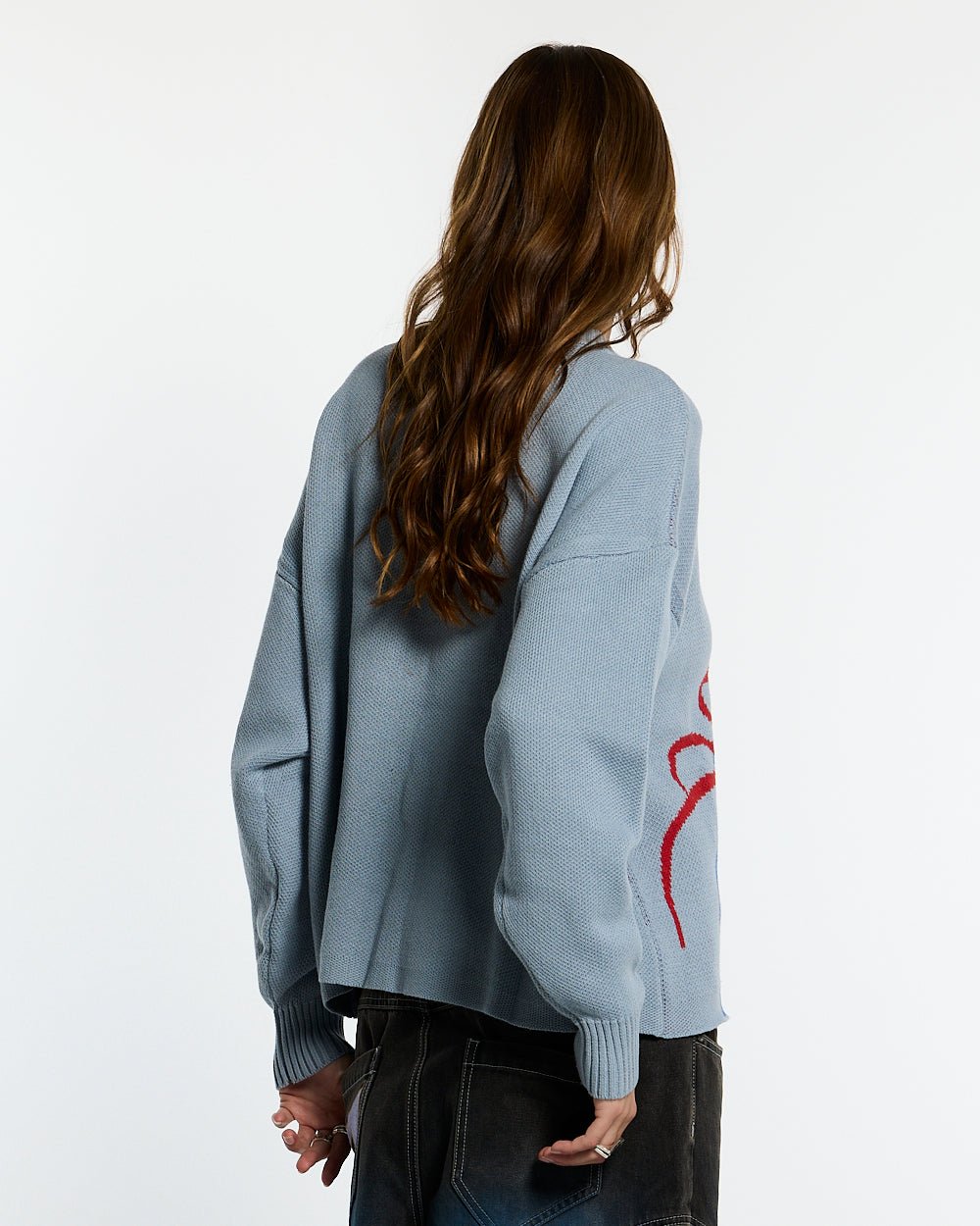 SPIDER KNIT LIGHT BLUE - light blue spider print knit sweater, back view on female model - Cold Culture #woman