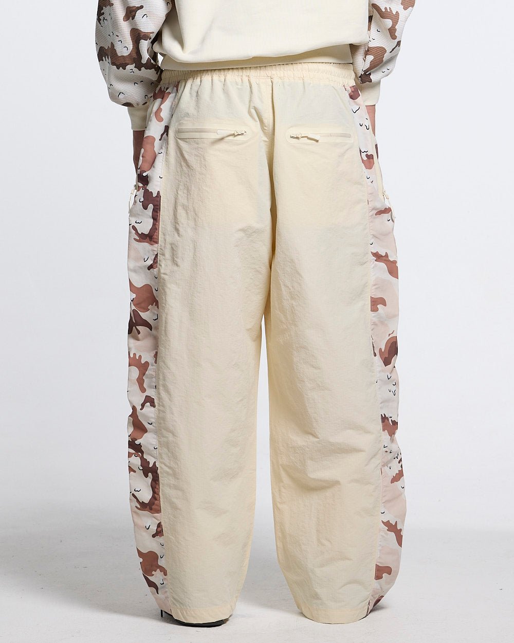 SPIDER PANTS BEIGE & CAMO - beige camo panel sweatpants, back view on male model - Cold Culture