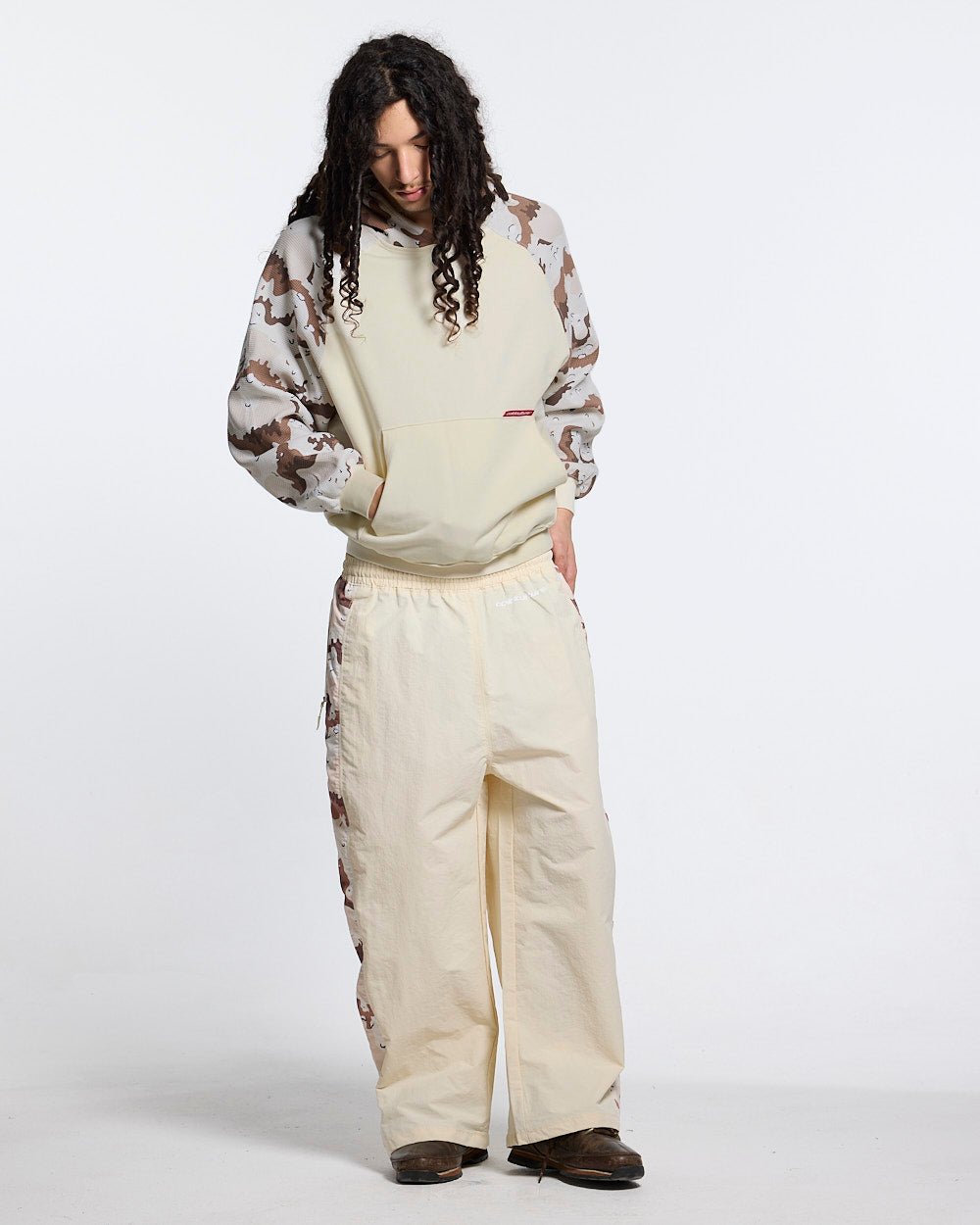 SPIDER PANTS BEIGE & CAMO - beige camo panel sweatpants, front view on male model - Cold Culture #man