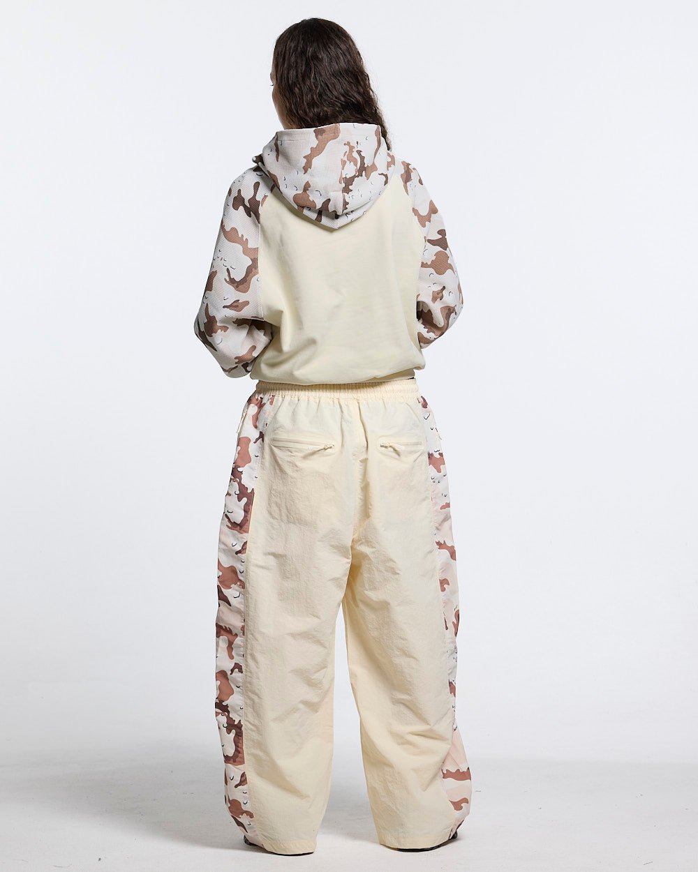 SPIDER PANTS BEIGE & CAMO - beige camo panel sweatpants, back view on female model - Cold Culture #woman