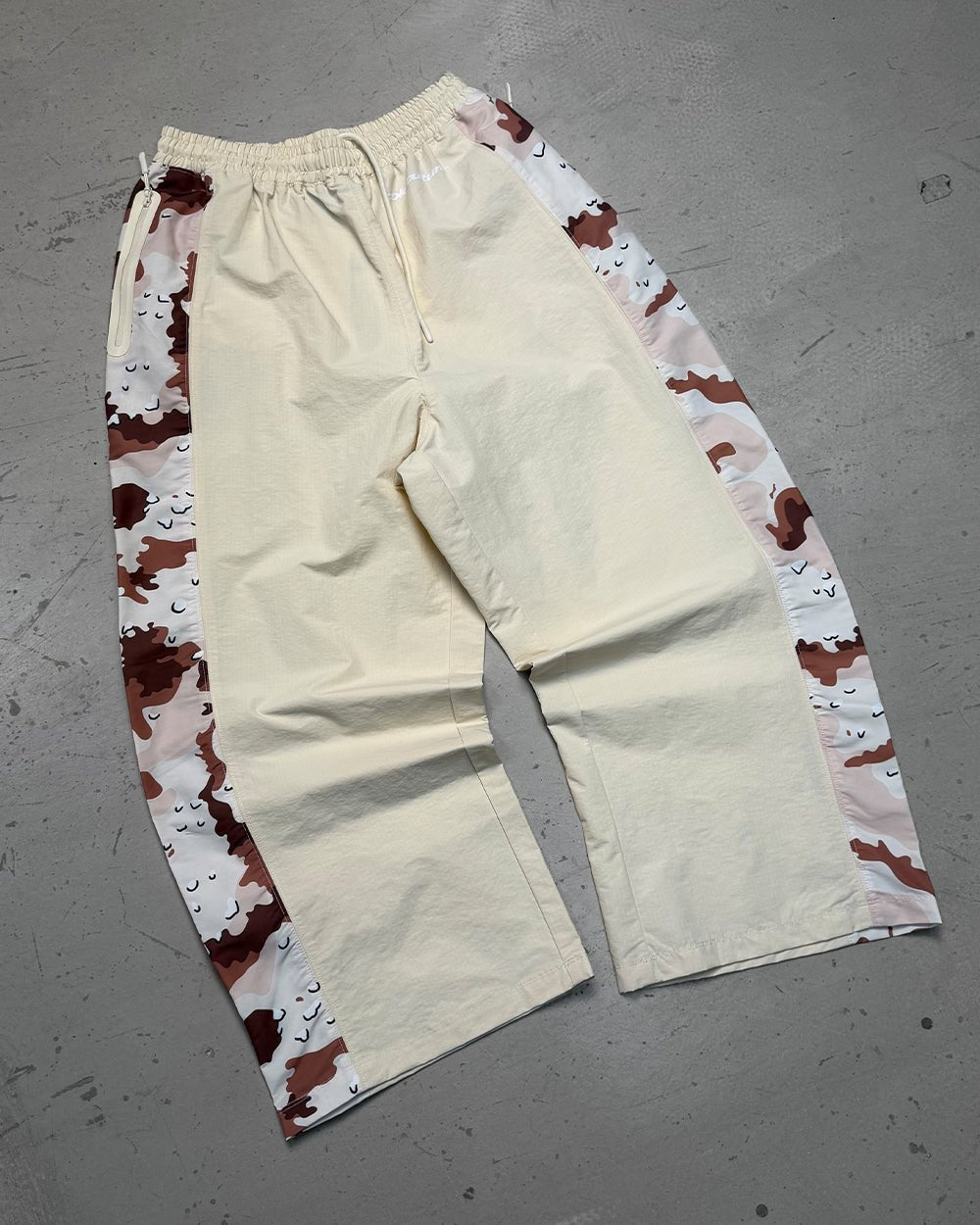 SPIDER PANTS BEIGE & CAMO - beige camo panel sweatpants, flat lay - Cold Culture