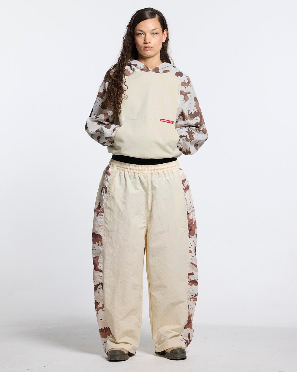SPIDER PANTS BEIGE & CAMO - beige camo panel sweatpants, front view on female model - Cold Culture #woman