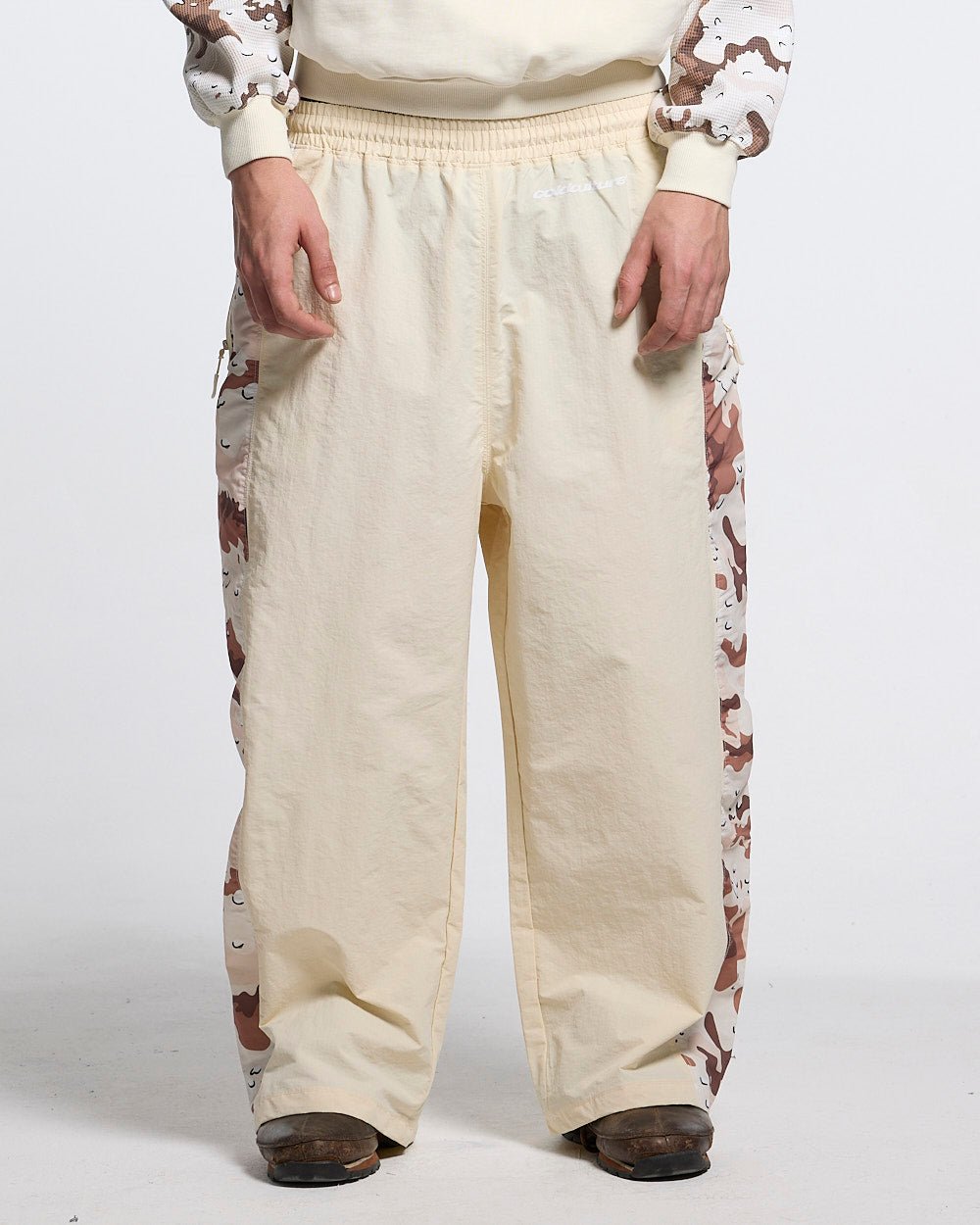 SPIDER PANTS BEIGE & CAMO - beige camo panel sweatpants, front view on male model - Cold Culture