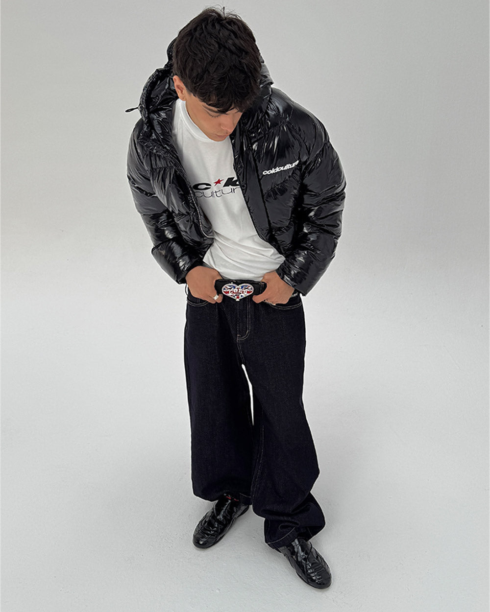 SPIRAL PUFFER GLOSSY BLACK - glossy black puffer jacket, front view on male model - Cold Culture #man