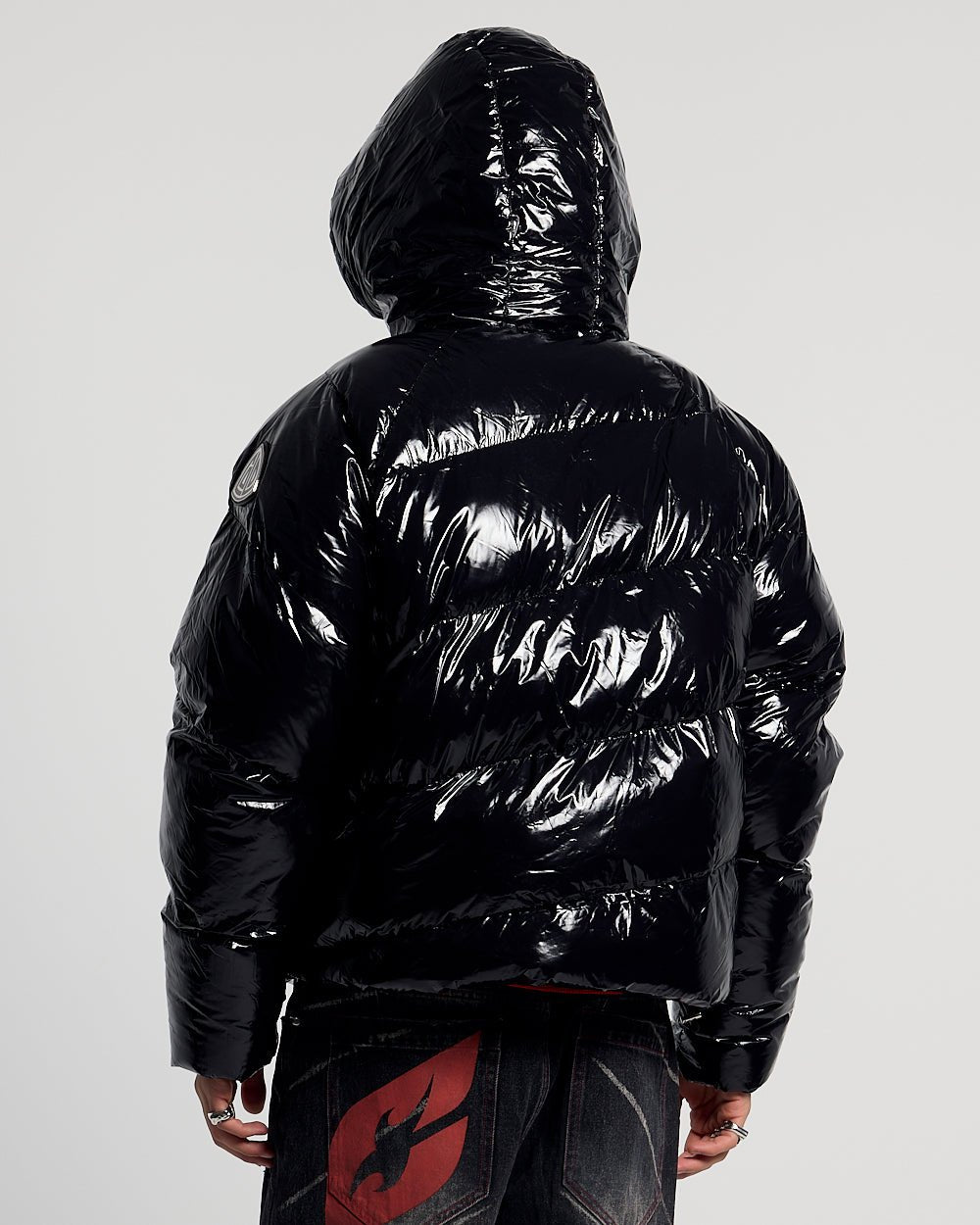 SPIRAL PUFFER GLOSSY BLACK - glossy black puffer jacket, back view on male model - Cold Culture
