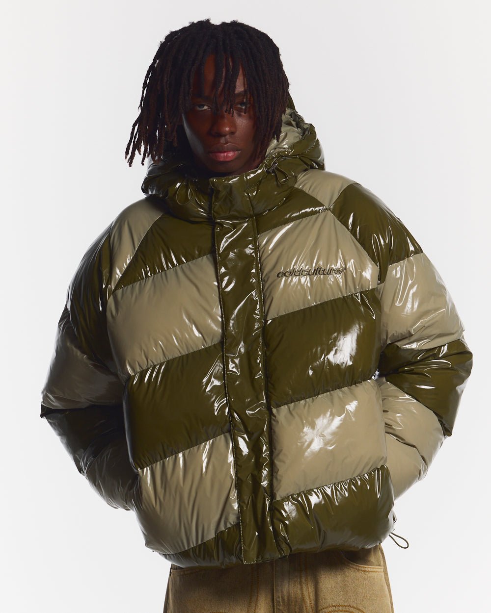 SPIRAL PUFFER GLOSSY GREEN MIX - green striped puffer jacket, front view on male model - Cold Culture #man