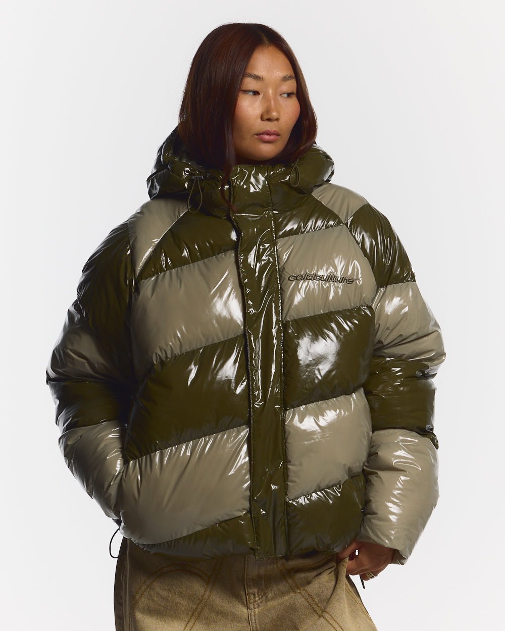 SPIRAL PUFFER GLOSSY GREEN MIX - green striped puffer jacket, front view on female model - Cold Culture #woman