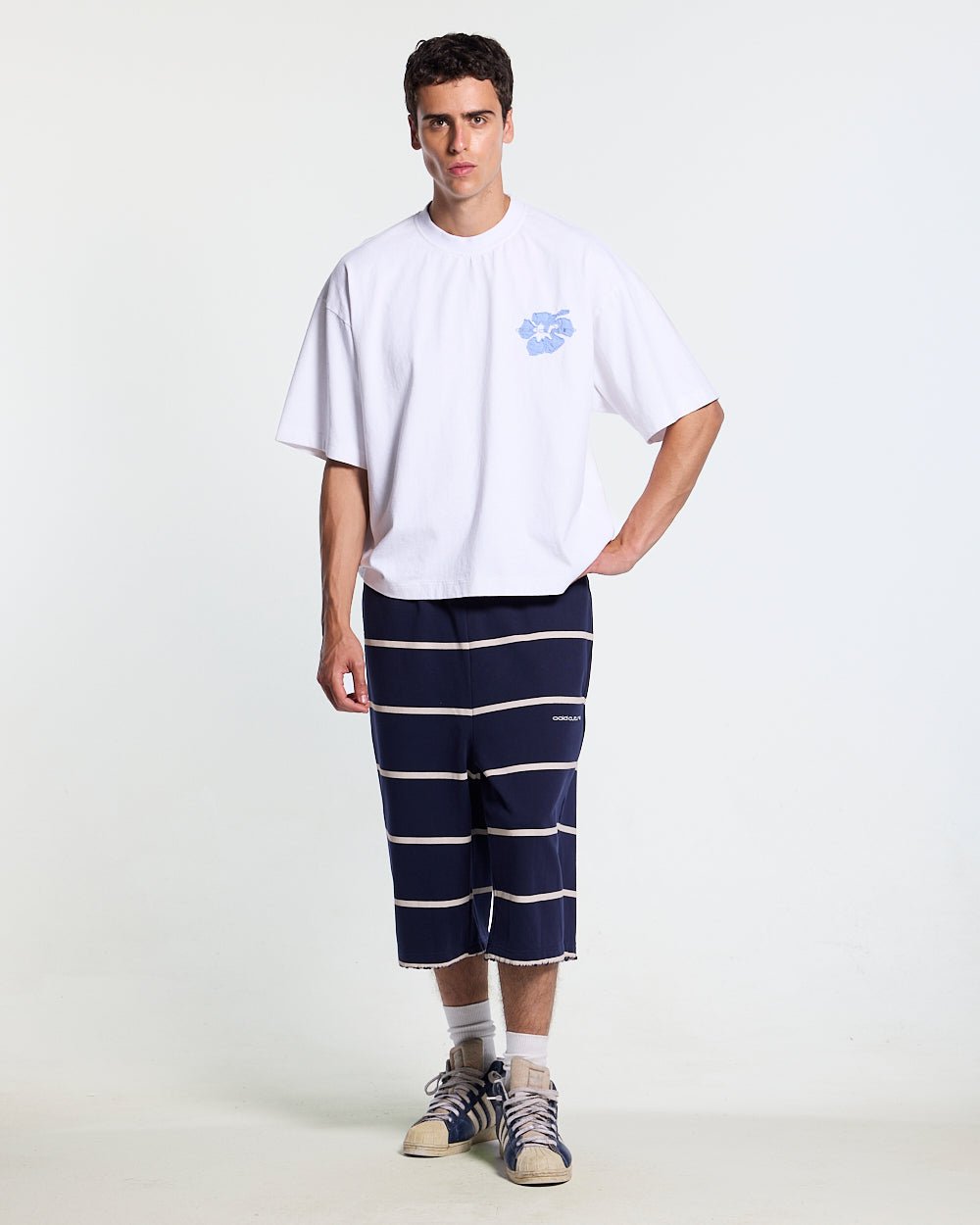 STALLION SHORT SWEATPANTS NAVY - navy striped sweat shorts, front view on male model - Cold Culture #man