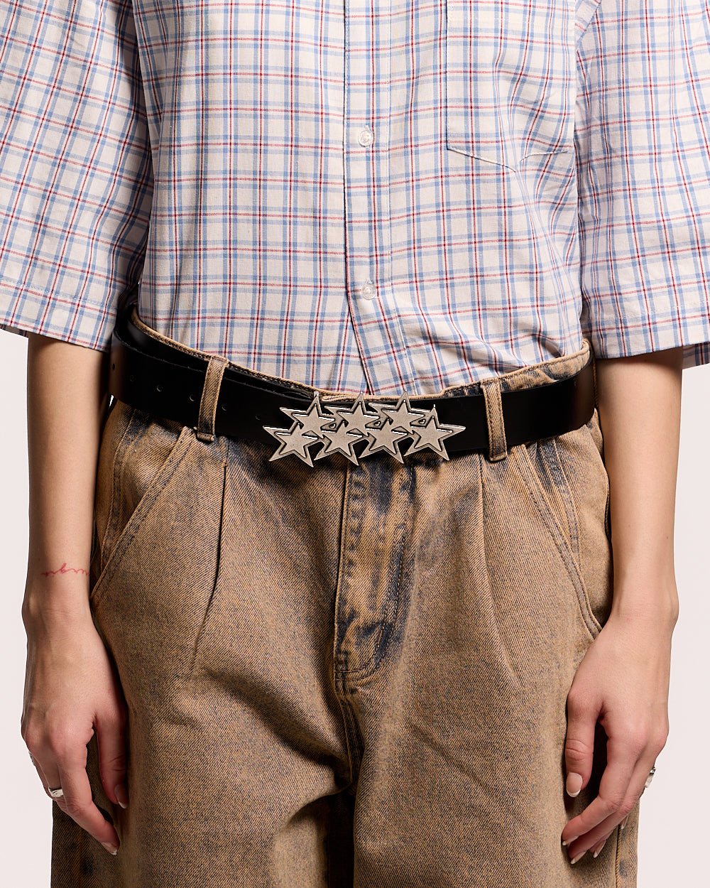 STARS LEATHER BELT BLACK - black leather star buckle belt, front view on female model - Cold Culture