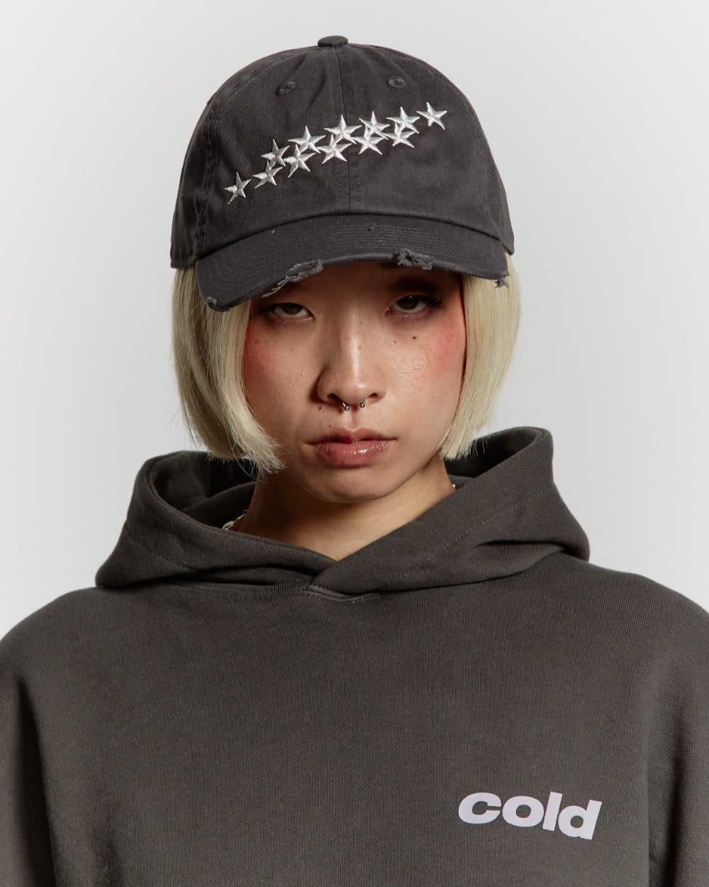 STARS CAP DARK GREY - dark grey distressed cap, on model close-up - Cold Culture #woman