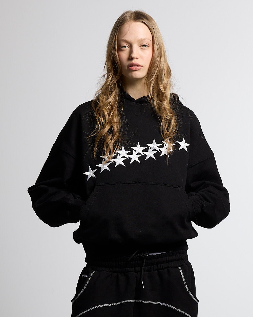 STARS HOODIE BLACK - black oversized hoodie, front view on female model - Cold Culture #woman